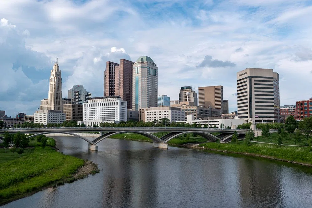 Columbus, OH skyline with the Scioto River and a bridge in the foreground