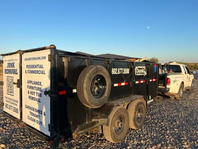 TrailersPlus employee servicing a cargo trailer